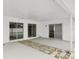 Covered patio with stone pathway, recessed lights, and sliding glass doors leading to the pool area at 4902 Stolls Ave, Tampa, FL 33615