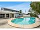 Backyard view of the pool and two-story home at 4902 Stolls Ave, Tampa, FL 33615