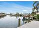 Waterfront property with a private dock and boat lift, offering convenient access to the water at 4902 Stolls Ave, Tampa, FL 33615