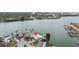 Aerial view of waterfront property with private dock, lush landscaping, and stunning water views at 7800 3Rd S Ave, St Petersburg, FL 33707
