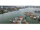 Stunning aerial view of waterfront home with lush landscaping, docks, and serene water access at 7800 3Rd S Ave, St Petersburg, FL 33707