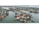 Breathtaking aerial view showcases waterfront home with private dock, lush landscaping, and expansive waterway at 7800 3Rd S Ave, St Petersburg, FL 33707