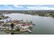 Stunning aerial view of waterfront home with pool, dock and beautiful landscaping on the water at 7800 3Rd S Ave, St Petersburg, FL 33707