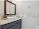 Stylish bathroom featuring a vanity with granite countertop and ample storage space at 8856 Christie Dr # 0, Largo, FL 33771