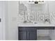 Beautiful bathroom vanity with a stylish gray sink and countertop with ample space at 8856 Christie Dr # 0, Largo, FL 33771