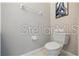 Cozy powder room featuring a toilet and towel rack complemented by neutral wall color and sleek design at 8856 Christie Dr # 0, Largo, FL 33771