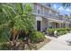 Beautiful townhome exterior with lush landscaping, well-manicured walkway, and inviting front entrance at 8856 Christie Dr # 0, Largo, FL 33771