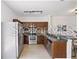 Well-lit kitchen featuring stainless steel appliances, sleek countertops, and modern lighting at 8856 Christie Dr # 0, Largo, FL 33771