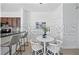 Bright kitchen with a dining nook, black granite countertops, and stainless steel appliances at 8856 Christie Dr # 0, Largo, FL 33771