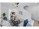 Comfortable and stylish living room featuring neutral tones, a modern ceiling fan, and plenty of natural light at 8856 Christie Dr # 0, Largo, FL 33771