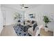 Bright and modern living room featuring hardwood floors, neutral tones, and comfortable seating area at 8856 Christie Dr # 0, Largo, FL 33771