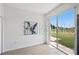Versatile living area featuring sliding glass doors and minimalist decor at 8856 Christie Dr # 0, Largo, FL 33771