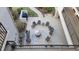 Open outdoor community patio with ample seating, grilling area, and tranquil landscaping at 1806 Mariner Dr # 318, Tarpon Springs, FL 34689