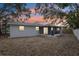 The backyard offers a relaxing outdoor space, with a screened lanai and views of the surrounding landscape at 11592 110Th Ter, Seminole, FL 33778