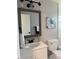 Charming bathroom with updated vanity, stylish framed mirror, and modern fixtures at 11592 110Th Ter, Seminole, FL 33778