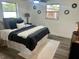 Cozy bedroom featuring luxury vinyl floors, neutral paint, ceiling fan, and lots of natural light at 11592 110Th Ter, Seminole, FL 33778