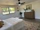 Comfortable bedroom featuring a decorative rug, natural light, and neutral decor at 11592 110Th Ter, Seminole, FL 33778