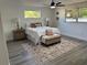 Cozy bedroom with a comfortable bed, stylish rug, and plenty of natural light at 11592 110Th Ter, Seminole, FL 33778