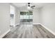 Bright dining area featuring modern sliding doors with a view to the patio at 11592 110Th Ter, Seminole, FL 33778