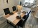 Stylishly staged dining area with sleek table and chairs, open to the living room at 11592 110Th Ter, Seminole, FL 33778