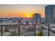The balcony features clear railings and picturesque sunset views with distant buildings at 301 1St S St # 2006, St Petersburg, FL 33701