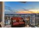 Beautiful balcony with wicker seating and stunning city views during sunset at 301 1St S St # 2006, St Petersburg, FL 33701
