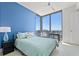 Cozy bedroom featuring large windows with breathtaking views and modern furniture at 301 1St S St # 2006, St Petersburg, FL 33701