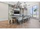 Brightly lit common room with a large table and seating for dining and socializing, with large windows overlooking the ocean at 301 1St S St # 2006, St Petersburg, FL 33701