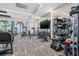 Bright community gym offers treadmills, free weights, and weight machines with large windows overlooking palm trees at 301 1St S St # 2006, St Petersburg, FL 33701