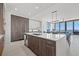 Gourmet kitchen boasts an island with countertop, stainless steel appliances, and sleek cabinetry at 301 1St S St # 2006, St Petersburg, FL 33701