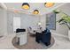 The lobby features stylish modern furniture and decor, with unique light fixtures and a large plant at 301 1St S St # 2006, St Petersburg, FL 33701