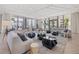 Open-concept lobby with ample natural light, modern furniture, and access to the outdoor patio and seating area at 301 1St S St # 2006, St Petersburg, FL 33701