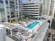 Rooftop pool with lounge chairs and umbrellas, perfect for relaxing and enjoying the city views at 301 1St S St # 2006, St Petersburg, FL 33701
