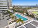 Resort-style swimming pool and lounge area with lush landscaping and bay views at 301 1St S St # 2006, St Petersburg, FL 33701