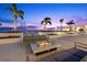 Relax on the rooftop patio with a stylish fire table and beautiful city views at dusk at 301 1St S St # 2006, St Petersburg, FL 33701