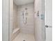 Contemporary shower with bench and rainfall showerhead offers a spa-like experience at 301 1St S St # 2006, St Petersburg, FL 33701