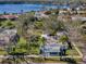 An aerial perspective of a charming home with lush greenery and tranquil waterfront views at 402 Pineapple St, Tarpon Springs, FL 34689