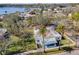 Aerial view of a cozy home, boasting mature trees and a serene waterfront backdrop at 402 Pineapple St, Tarpon Springs, FL 34689