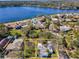 Aerial view of a single-Gathering home, highlighting its proximity to a lake and surrounding neighborhood at 402 Pineapple St, Tarpon Springs, FL 34689