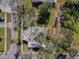 Aerial view of home and yard, showing the property's boundaries surrounded by mature trees at 402 Pineapple St, Tarpon Springs, FL 34689