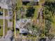 Aerial view of home and yard, showing the property's boundaries surrounded by mature trees at 402 Pineapple St, Tarpon Springs, FL 34689