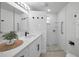 Bathroom featuring white subway tiles, stone flooring in the shower, and sleek fixtures at 402 Pineapple St, Tarpon Springs, FL 34689