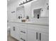 Bathroom featuring double sinks, modern vanity, and fixtures for a luxurious experience at 402 Pineapple St, Tarpon Springs, FL 34689