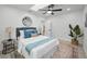 Bright bedroom with a ceiling fan, and a stylish rug, creating a cozy and inviting space at 402 Pineapple St, Tarpon Springs, FL 34689