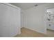 Hallway with a closet, leading to a bathroom featuring modern fixtures and finishes at 402 Pineapple St, Tarpon Springs, FL 34689