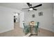Bright office space with neutral walls, featuring a ceiling fan and modern furnishings at 402 Pineapple St, Tarpon Springs, FL 34689