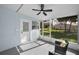 Enclosed patio featuring views of the backyard, and comfortable seating for outdoor relaxation at 402 Pineapple St, Tarpon Springs, FL 34689