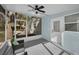 Enclosed screened porch with ceiling fan and view to the backyard at 402 Pineapple St, Tarpon Springs, FL 34689
