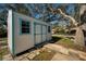 Backyard shed with double doors and small windows at 402 Pineapple St, Tarpon Springs, FL 34689