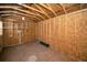 Shed interior with wood walls and ceiling, plus basic wiring and shelving at 402 Pineapple St, Tarpon Springs, FL 34689